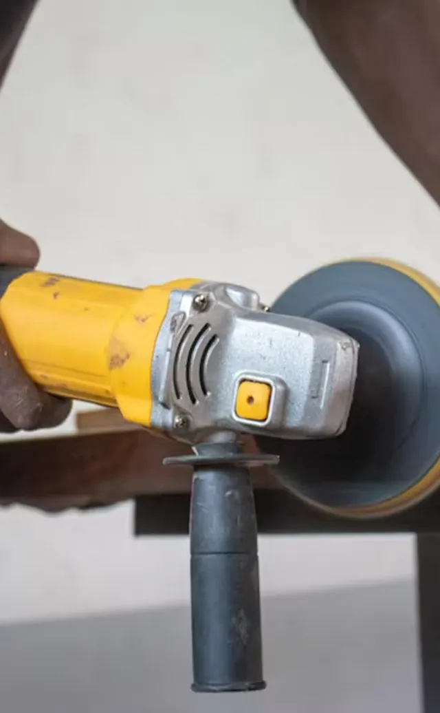 Angle grinder being used on a building repair